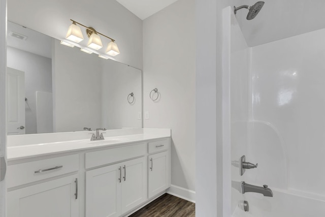 1001A 51st Ave N, Nashville, TN 37209 - bathroom with shower / tub combination, vanity, wood finished floors, and baseboards