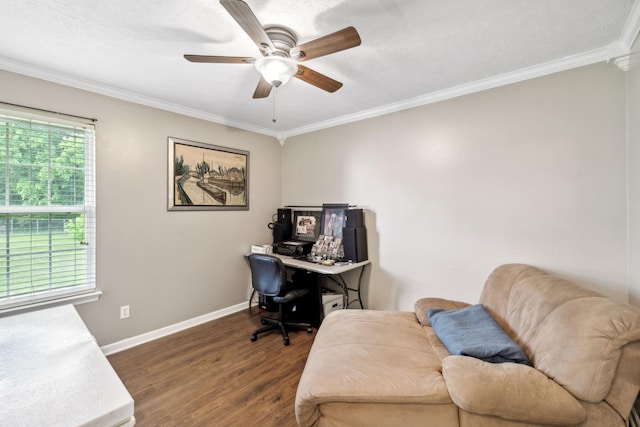 home office with dark wood-type flooring, crown molding, baseboards, and a ceiling fan