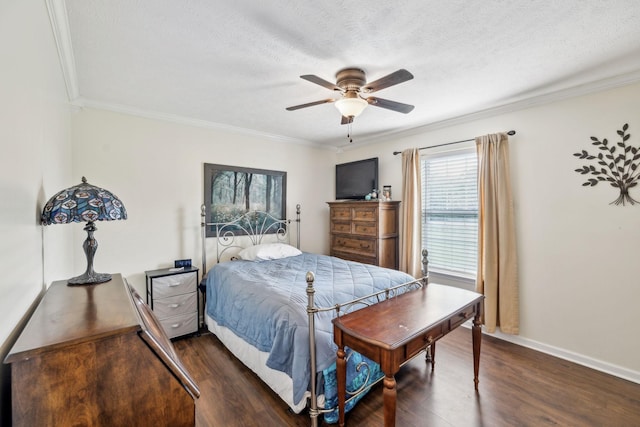 bedroom featuring dark wood-style flooring, ornamental molding, ceiling fan, a textured ceiling, and baseboards