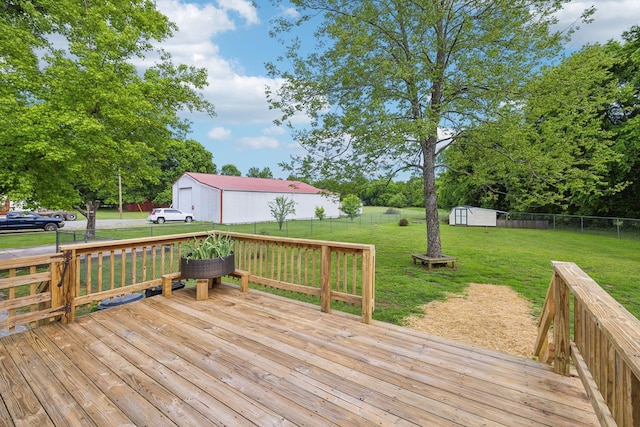 wooden terrace featuring an outbuilding and a storage shed