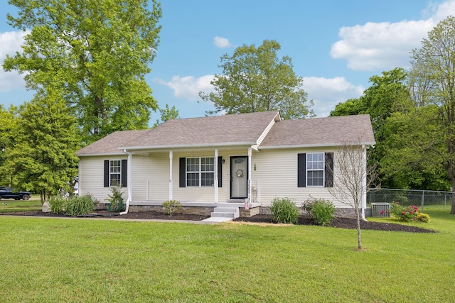 single story home with central AC, a shingled roof, and covered porch