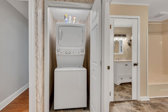 215 Wheeler Ave, Nashville, TN 37211 - washroom with stacked washer / drying machine, baseboards, and ornamental molding