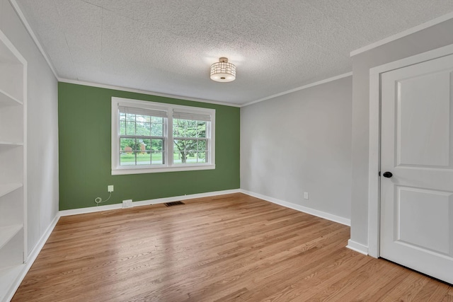 215 Wheeler Ave, Nashville, TN 37211 - spare room featuring crown molding, a textured ceiling, wood finished floors, and baseboards