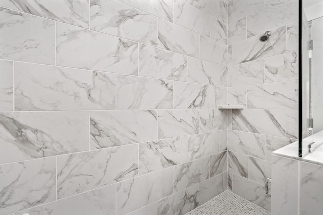 bathroom view of tiled shower