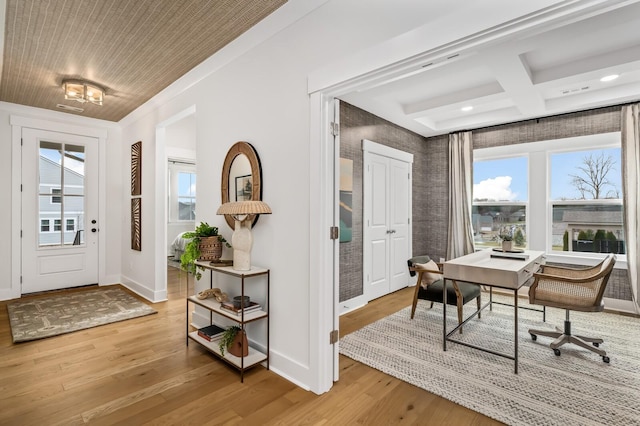 foyer entrance featuring plenty of natural light, wood finished floors, baseboards, coffered ceiling, and recessed lighting