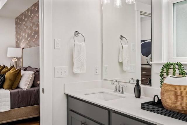 bathroom featuring connected bathroom and vanity