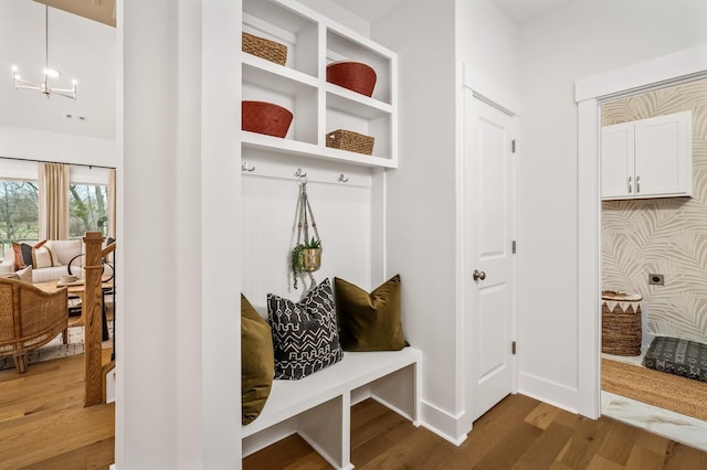 mudroom with wood finished floors and baseboards