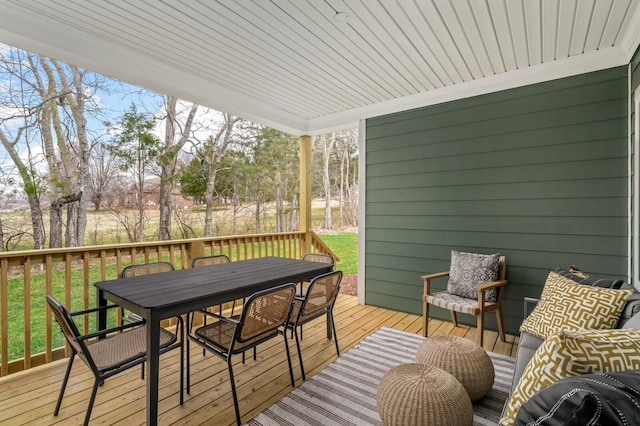 deck with outdoor dining area