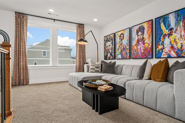 living area featuring carpet floors, baseboards, and recessed lighting