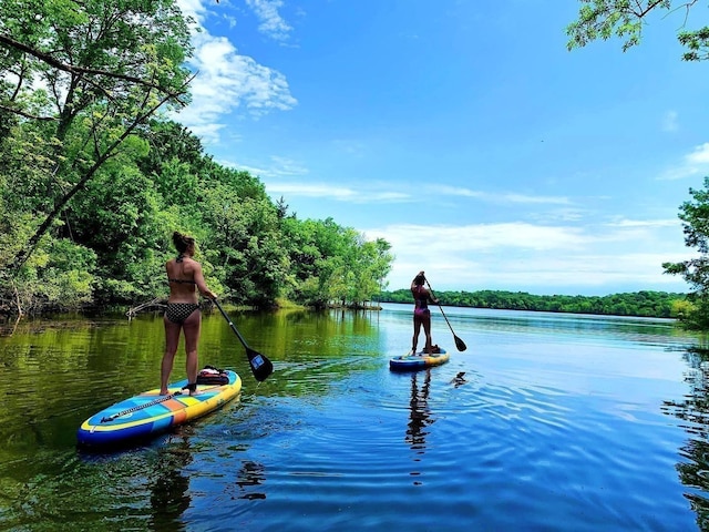 water view featuring a heavily wooded area