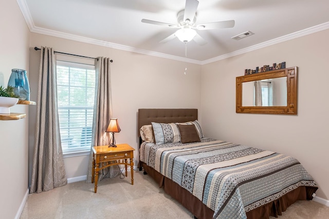 bedroom with carpet, crown molding, baseboards, and a ceiling fan