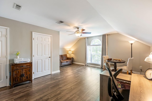 office space featuring a ceiling fan, vaulted ceiling, dark wood-style flooring, and baseboards