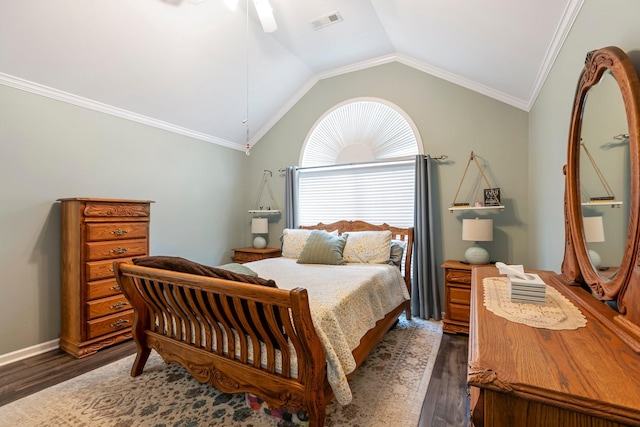 bedroom with dark wood-type flooring, vaulted ceiling, ornamental molding, and a ceiling fan