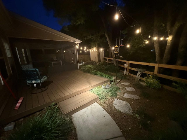 deck at night with fence