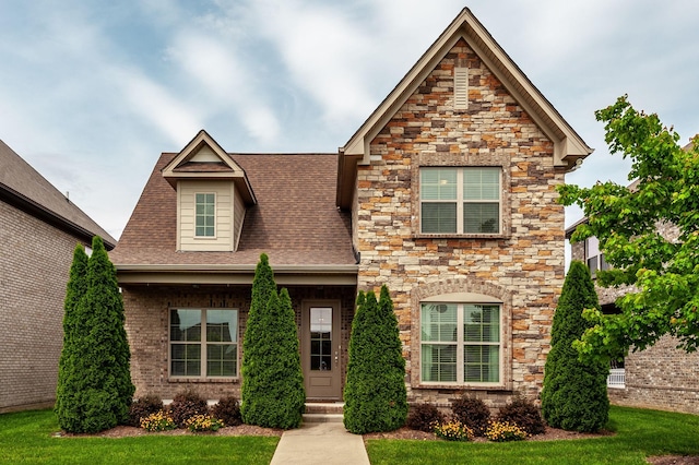 1064 Ambling Way, Gallatin, TN 37066 - craftsman-style home featuring stone siding, a front lawn, and a shingled roof