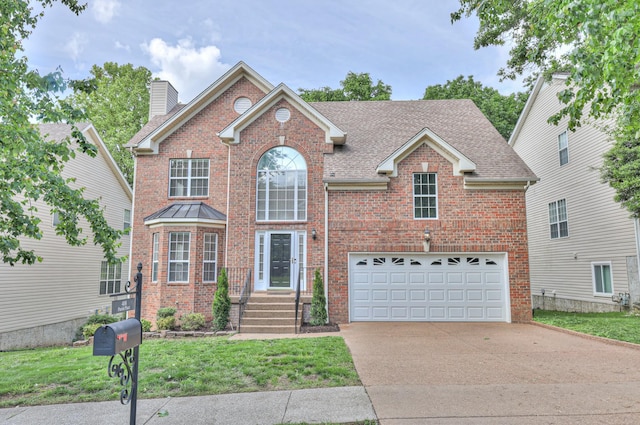 408 Parish Pl, Franklin, TN 37067 - traditional home with brick siding, concrete driveway, a chimney, and an attached garage