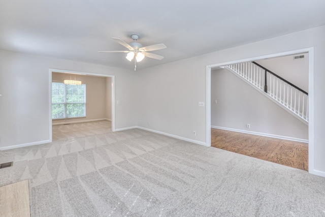 408 Parish Pl, Franklin, TN 37067 - carpeted spare room with a chandelier, ceiling fan, stairs, and baseboards