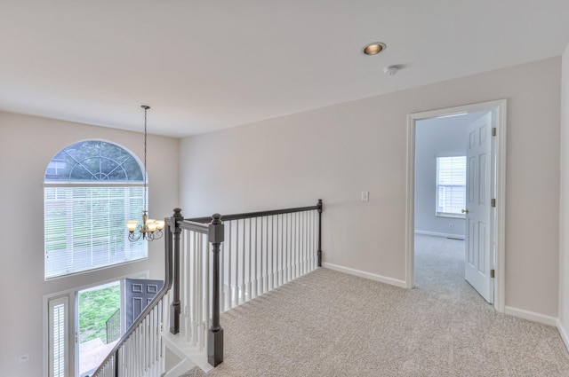 408 Parish Pl, Franklin, TN 37067 - hallway featuring a chandelier, healthy amount of natural light, carpet floors, and an upstairs landing