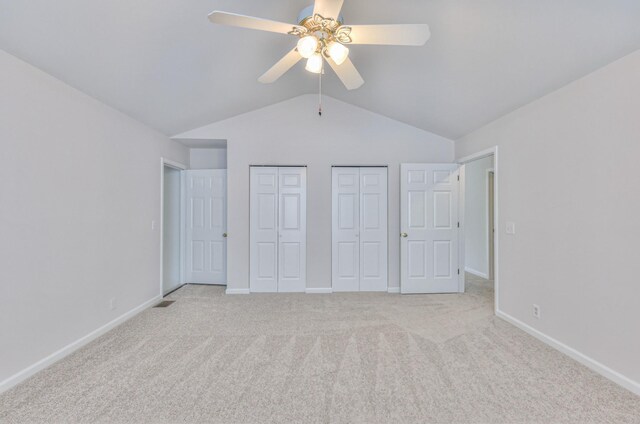 408 Parish Pl, Franklin, TN 37067 - unfurnished bedroom featuring multiple closets, lofted ceiling, light carpet, and baseboards