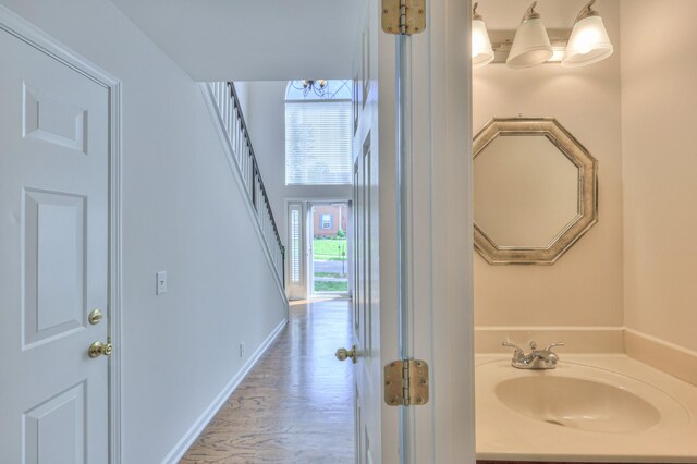408 Parish Pl, Franklin, TN 37067 - bathroom with vanity, wood finished floors, and baseboards