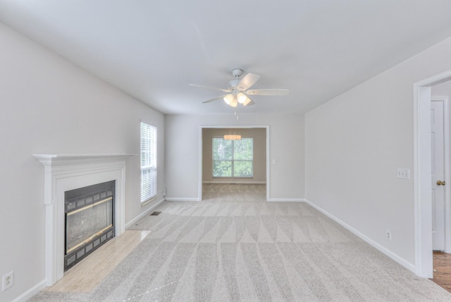 408 Parish Pl, Franklin, TN 37067 - unfurnished living room featuring a ceiling fan, a fireplace with flush hearth, baseboards, and carpet