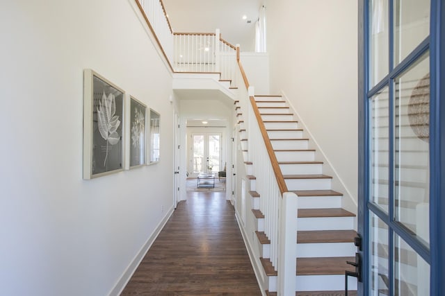431B Basswood Ave, Nashville, TN 37209 - hallway featuring french doors, stairway, wood finished floors, baseboards, and a towering ceiling