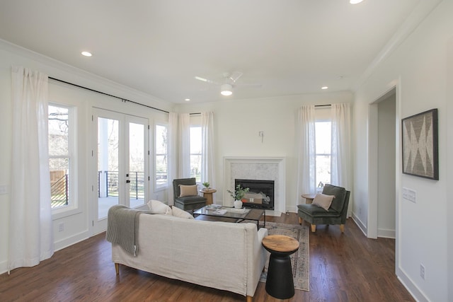 431B Basswood Ave, Nashville, TN 37209 - living area featuring french doors, crown molding, a fireplace with flush hearth, dark wood-style flooring, and recessed lighting