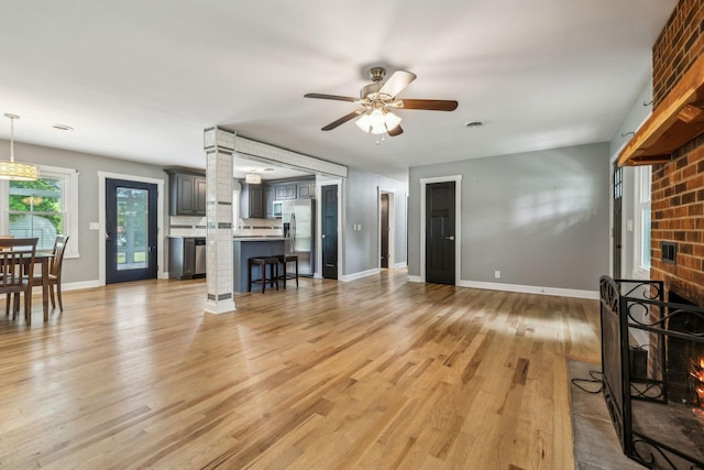4408 Alpine Way, Murfreesboro, TN 37129 - living room with baseboards, a brick fireplace, ceiling fan, and light wood finished floors