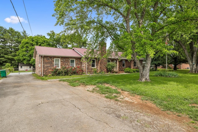 4408 Alpine Way, Murfreesboro, TN 37129 - ranch-style house with driveway, brick siding, a chimney, a front yard, and metal roof