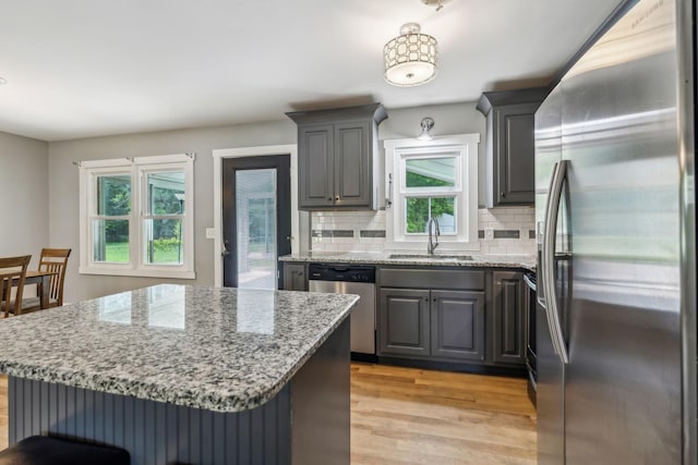 4408 Alpine Way, Murfreesboro, TN 37129 - kitchen featuring stainless steel appliances, a sink, gray cabinetry, light wood-type flooring, and tasteful backsplash