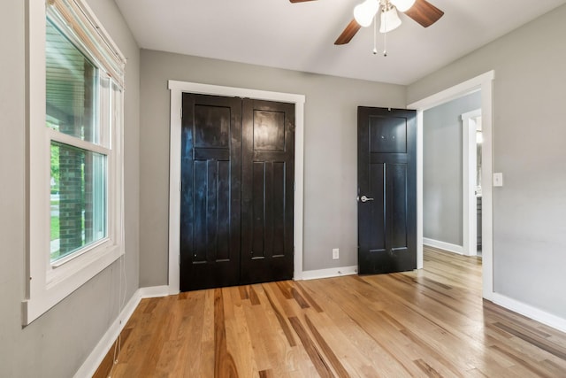 4408 Alpine Way, Murfreesboro, TN 37129 - unfurnished bedroom featuring multiple windows, baseboards, light wood-style floors, and a closet