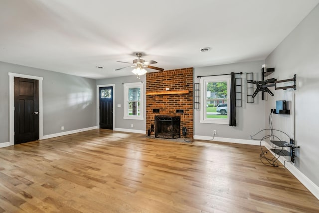 4408 Alpine Way, Murfreesboro, TN 37129 - unfurnished living room with healthy amount of natural light, light wood finished floors, a ceiling fan, and a fireplace
