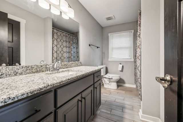 4408 Alpine Way, Murfreesboro, TN 37129 - bathroom featuring baseboards, wood tiled floors, toilet, and vanity