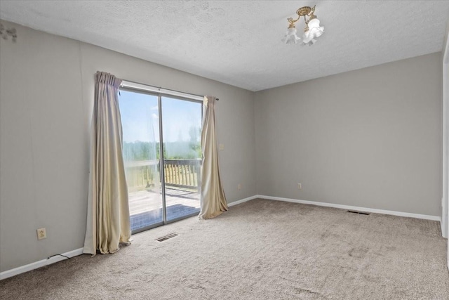 4410 Trace Creek Rd, Mc Ewen, TN 37101 - carpeted spare room with a chandelier, baseboards, and a textured ceiling