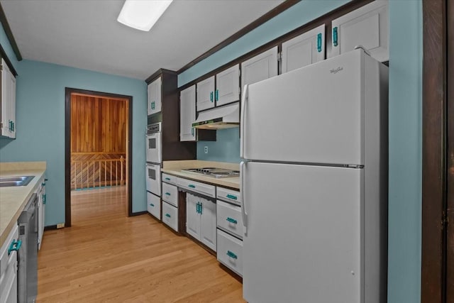 4410 Trace Creek Rd, Mc Ewen, TN 37101 - kitchen with white appliances, light countertops, under cabinet range hood, and light wood-style flooring