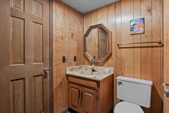 4410 Trace Creek Rd, Mc Ewen, TN 37101 - half bathroom with toilet, vanity, and wood walls