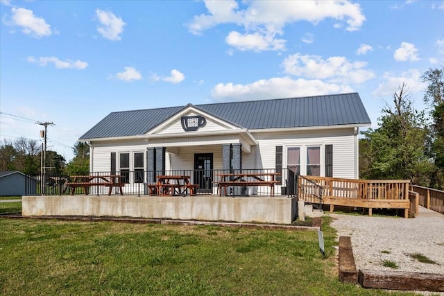 4410 Trace Creek Rd, Mc Ewen, TN 37101 - rear view of property with a yard, metal roof, and french doors