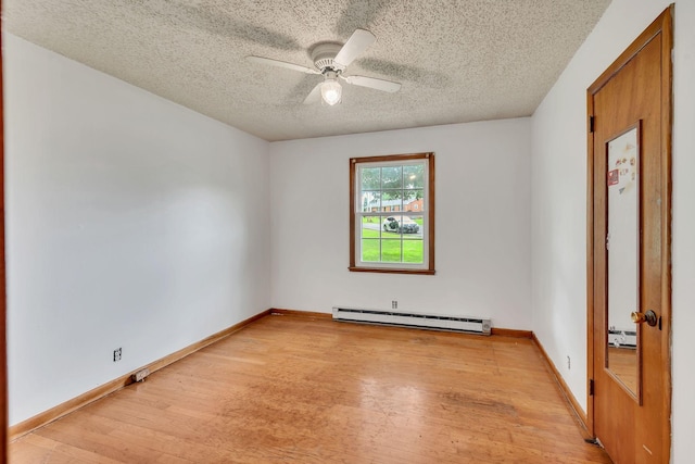 1006 Hillcrest Cir, Pleasant View, TN 37146 - unfurnished room featuring a baseboard heating unit, light wood finished floors, a textured ceiling, ceiling fan, and baseboards