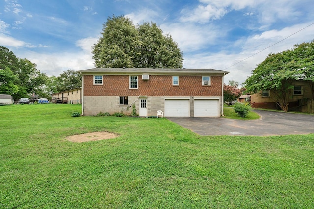 1006 Hillcrest Cir, Pleasant View, TN 37146 - rear view of property with asphalt driveway, a garage, brick siding, and a lawn