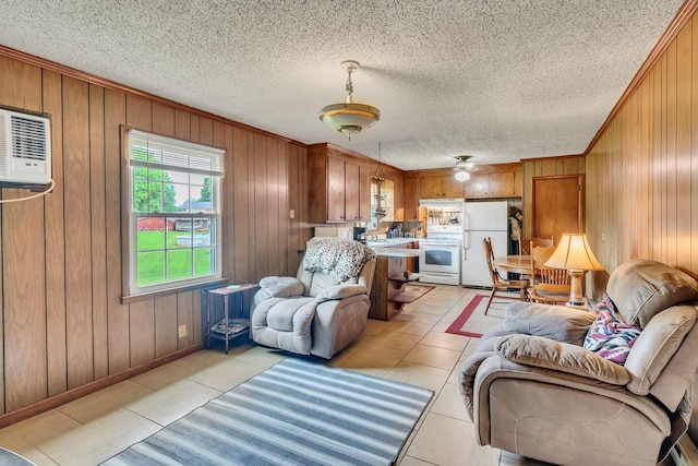 1006 Hillcrest Cir, Pleasant View, TN 37146 - living area with wood walls, light tile patterned floors, crown molding, baseboards, and an AC wall unit