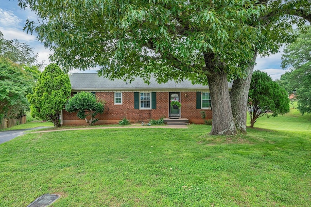 1006 Hillcrest Cir, Pleasant View, TN 37146 - ranch-style house featuring brick siding, a front yard, and a shingled roof