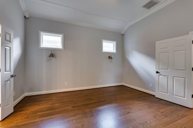 unfurnished room featuring crown molding, wood finished floors, and baseboards