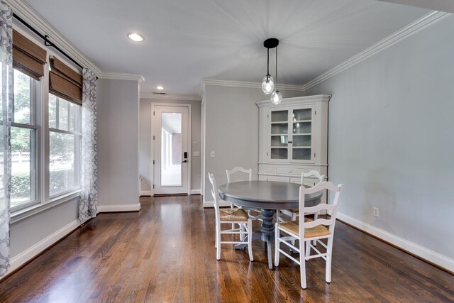 dining area with ornamental molding, dark wood-style floors, baseboards, and recessed lighting