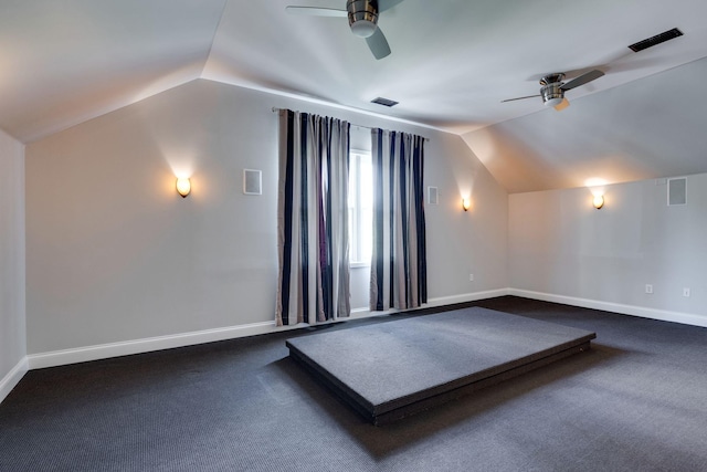 bonus room with ceiling fan, lofted ceiling, dark carpet, and baseboards
