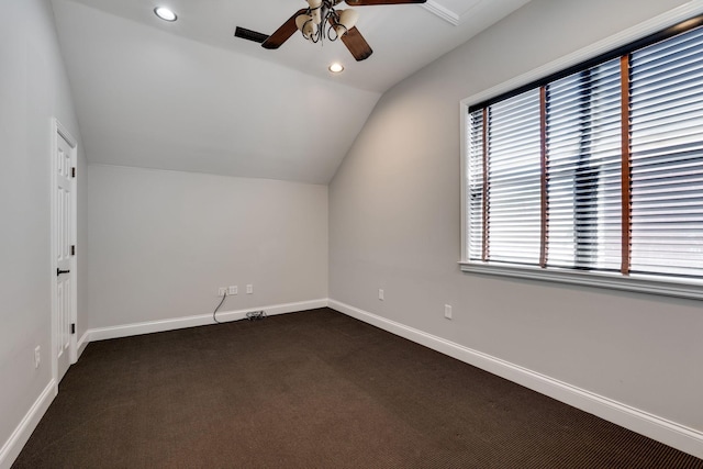 bonus room featuring vaulted ceiling, ceiling fan, dark carpet, baseboards, and recessed lighting