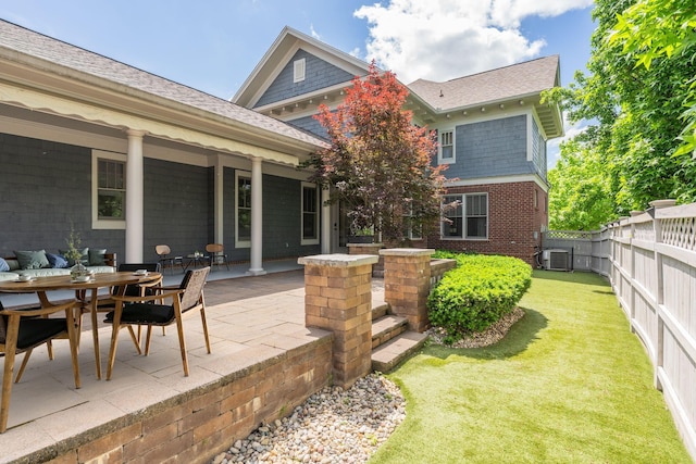 458 Wiregrass Ln, Franklin, TN 37064 - rear view of property with a fenced backyard, a patio area, roof with shingles, and brick siding
