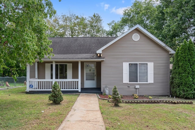 view of front of home with a porch and a shingled roof