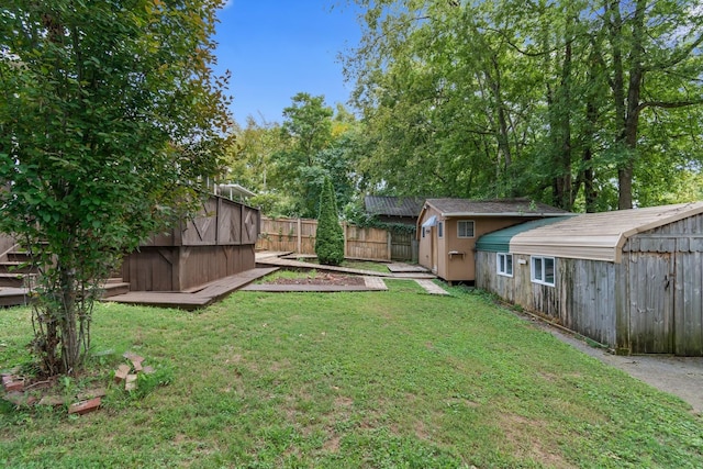view of yard featuring a storage shed and an outdoor structure
