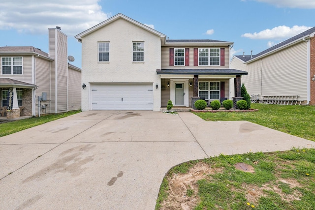 325 Golfview Ln, Springfield, TN 37172 - traditional home featuring a garage, covered porch, concrete driveway, and a front yard