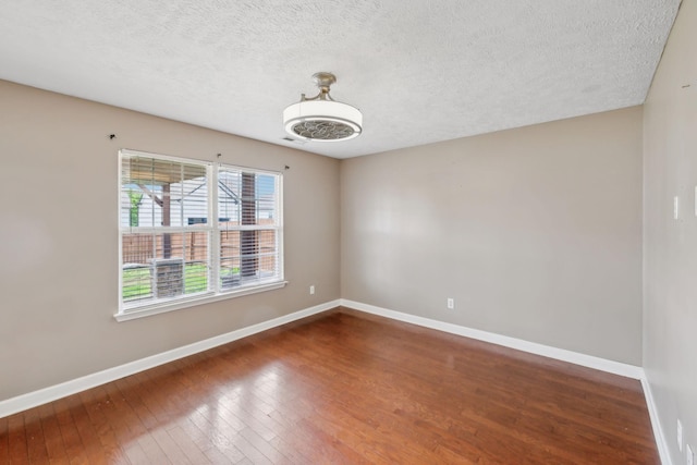 325 Golfview Ln, Springfield, TN 37172 - empty room with wood-type flooring, baseboards, and a textured ceiling